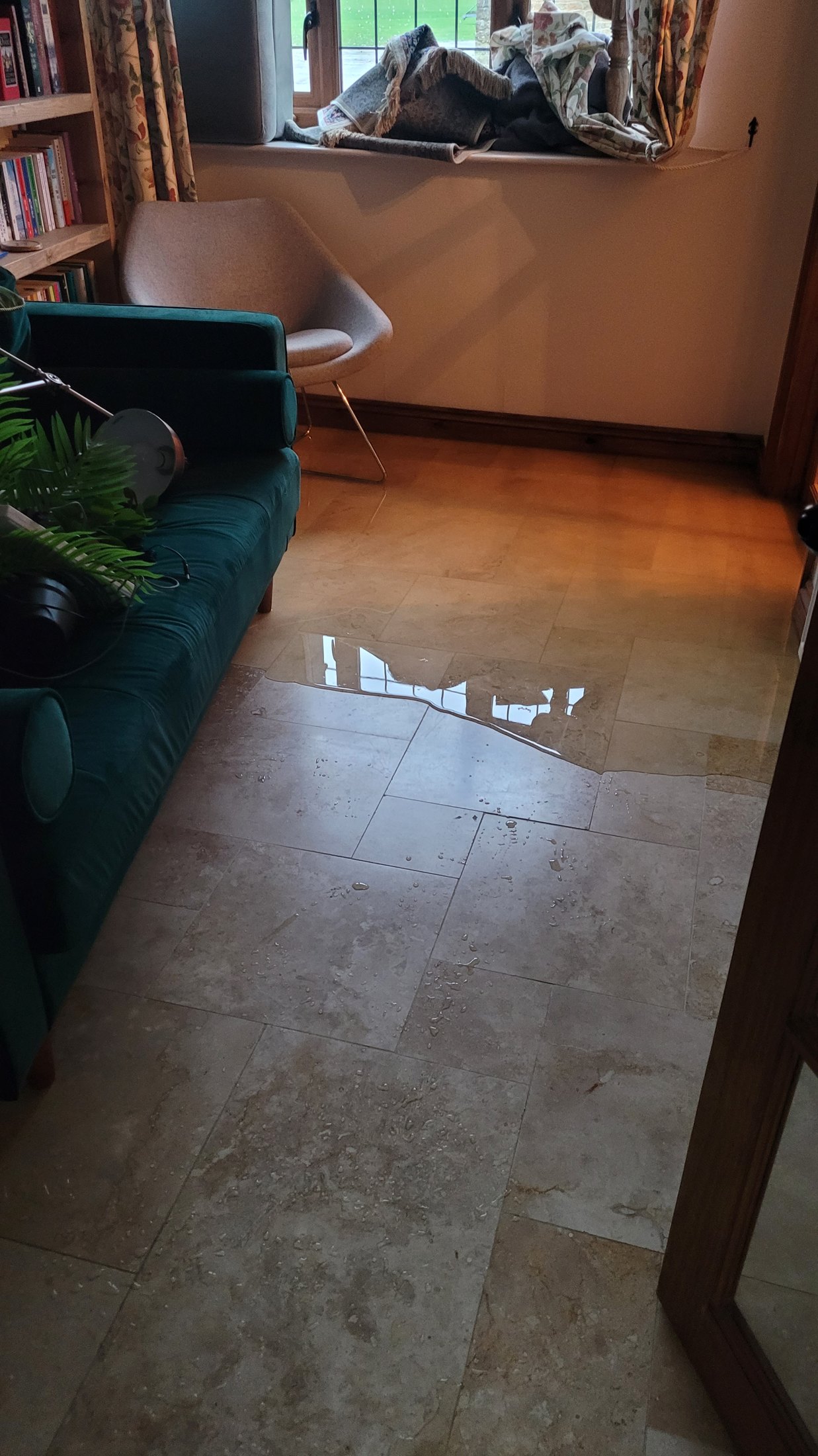 Floodwater spreading through a ground-floor room
